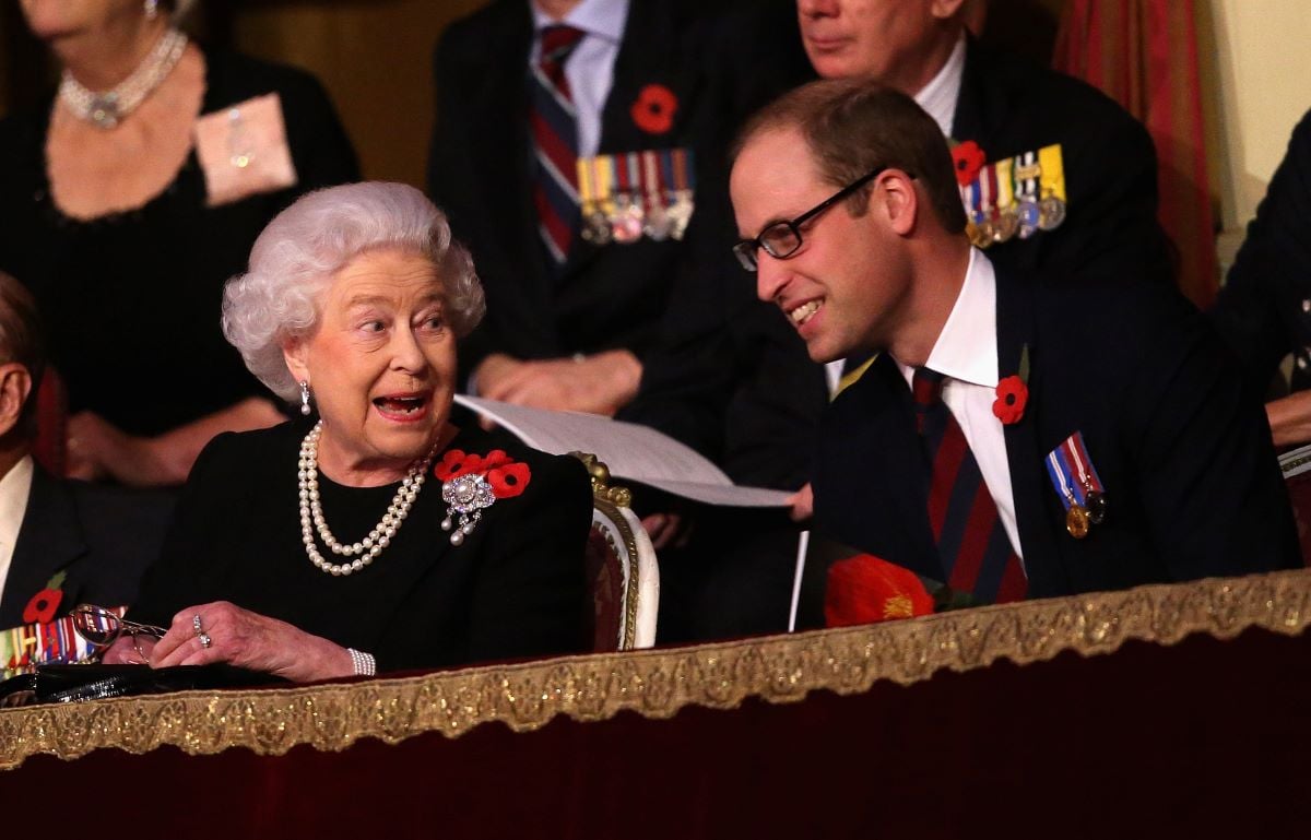 Queen Elizabeth II and Prince William chat to each other in the Royal Box at the Royal Albert Hall