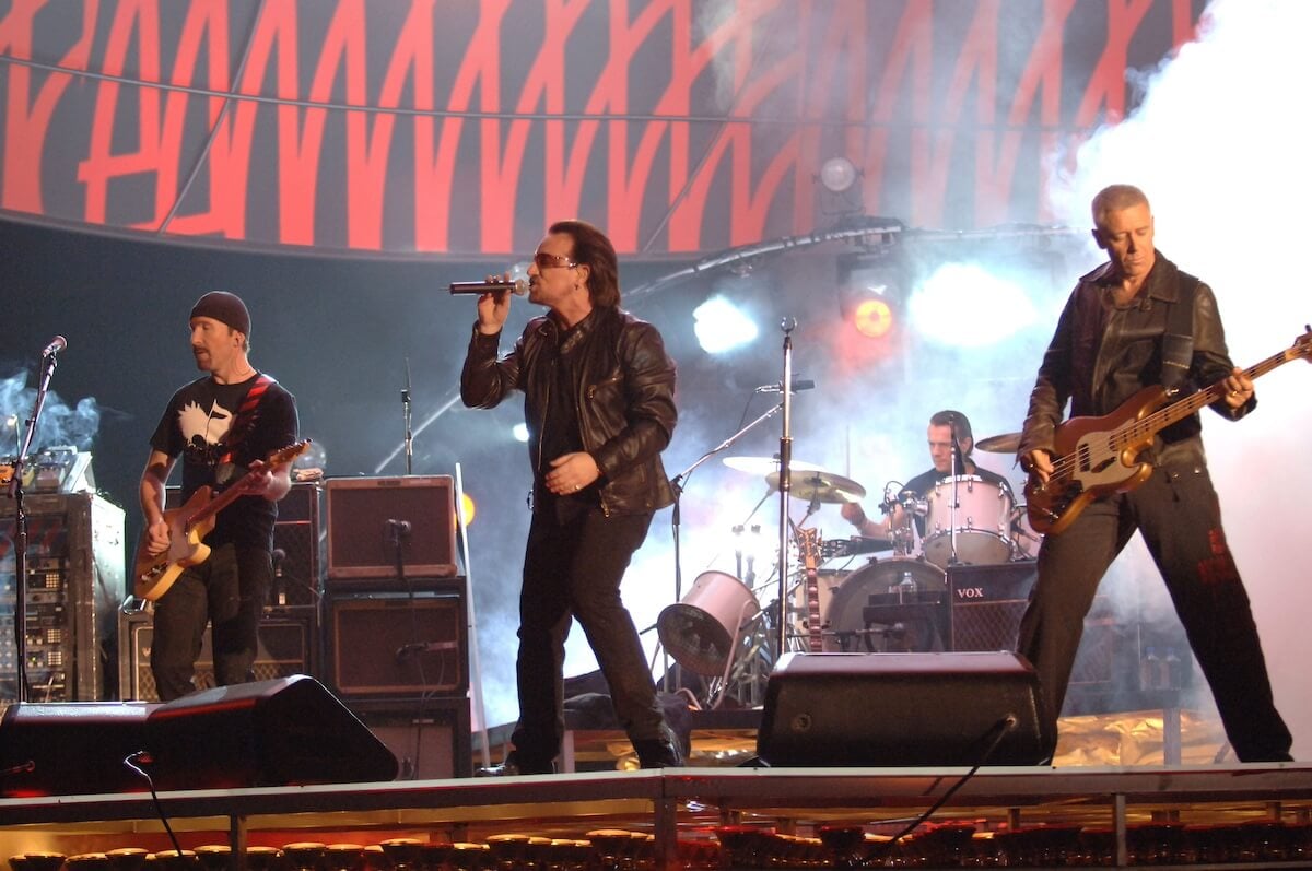 U2 performing onstage during rehearsals for the 48th Grammy Awards