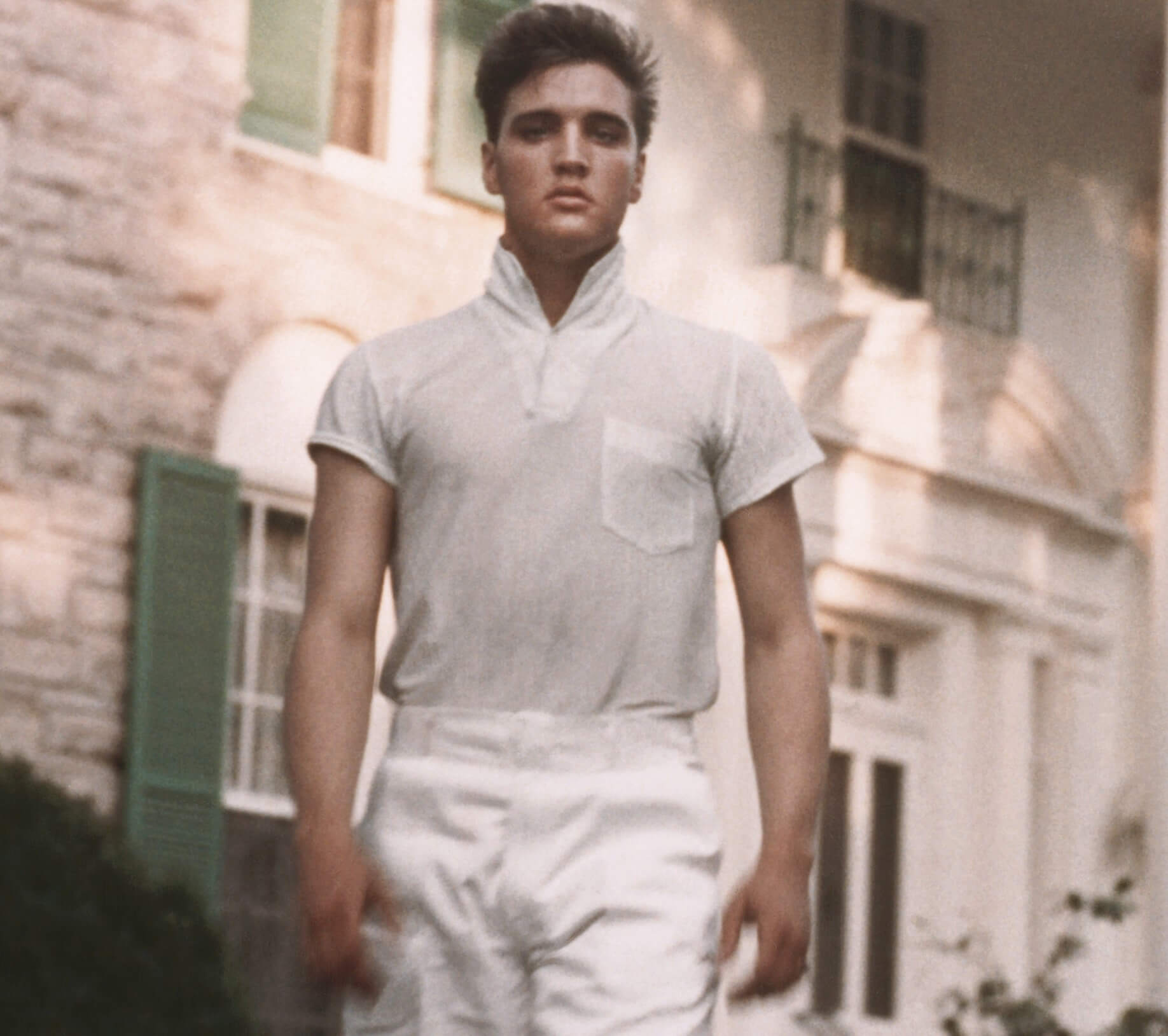 "Burning Love" singer Elvis Presley wearing white