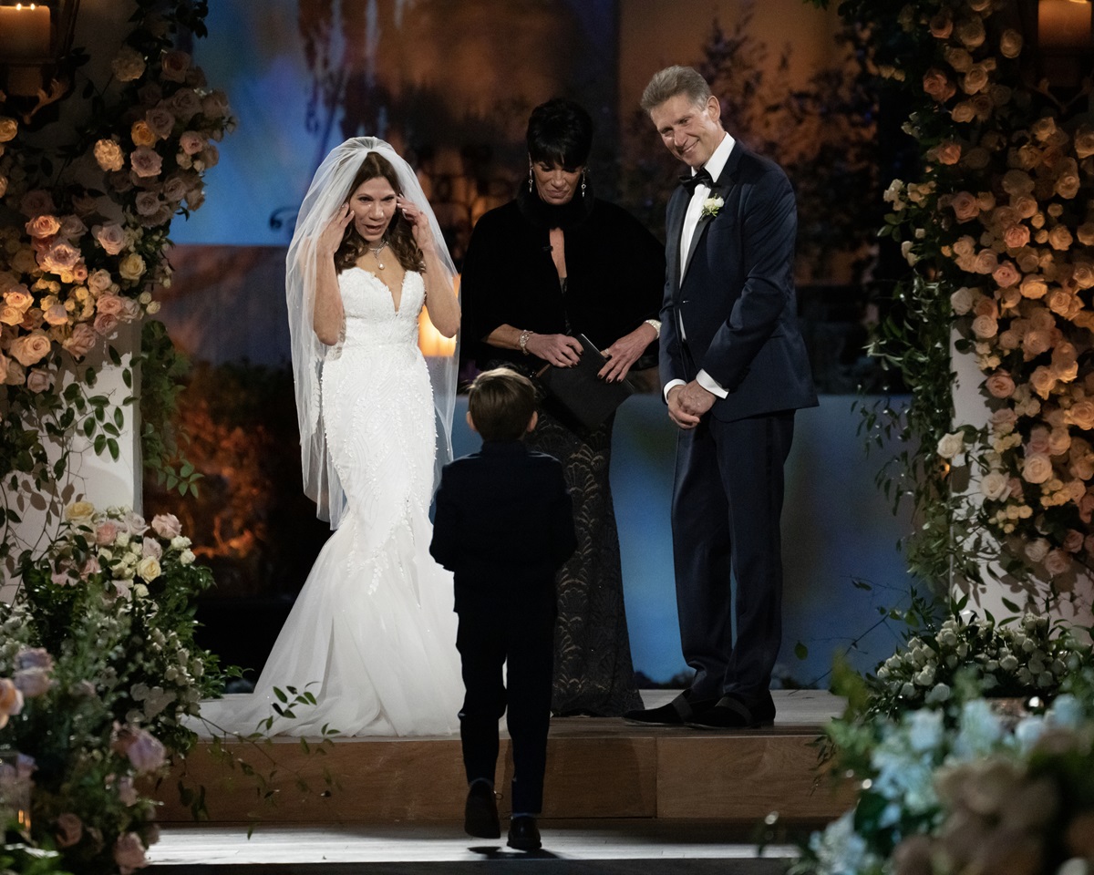 Theresa Nist and Gerry Turner stand at the altar together during their telivized wedding. Susan Noles officiated the event. Nist's grandson is also seen in the picture