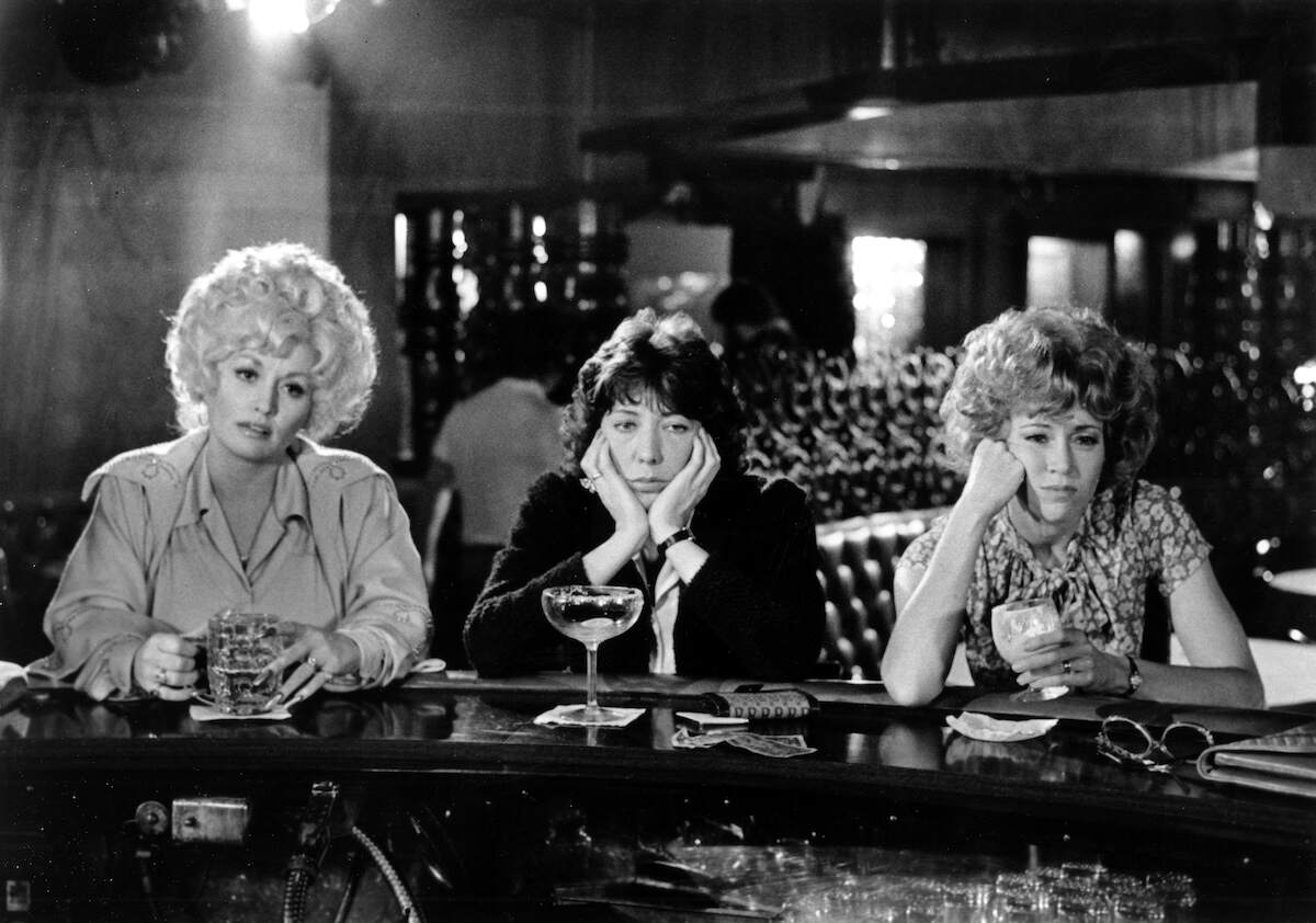 Actors Dolly Parton, Lily Tomlin, and Jane Fonda film a scene for 9 to 5 at a bar