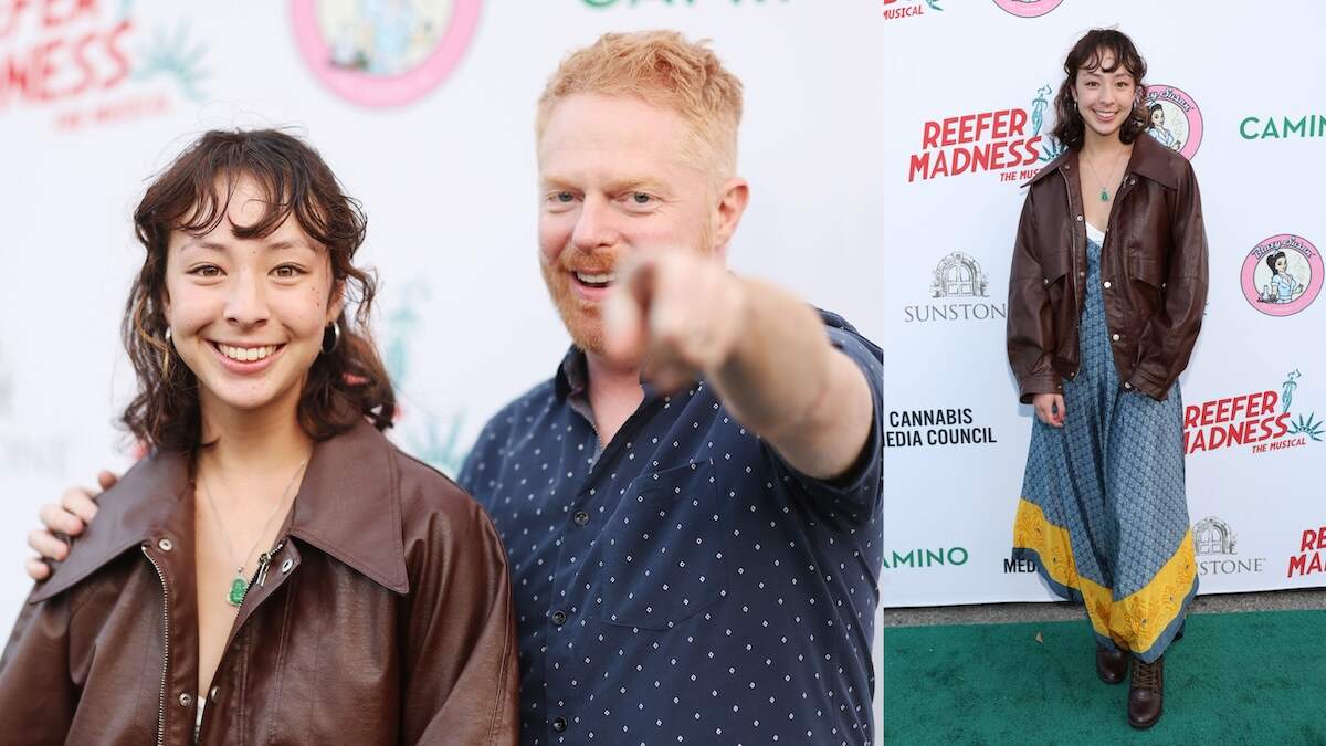 Modern Family stars Aubrey Anderson-Emmons and Jesse Tyler Ferguson laugh together on a red carpet