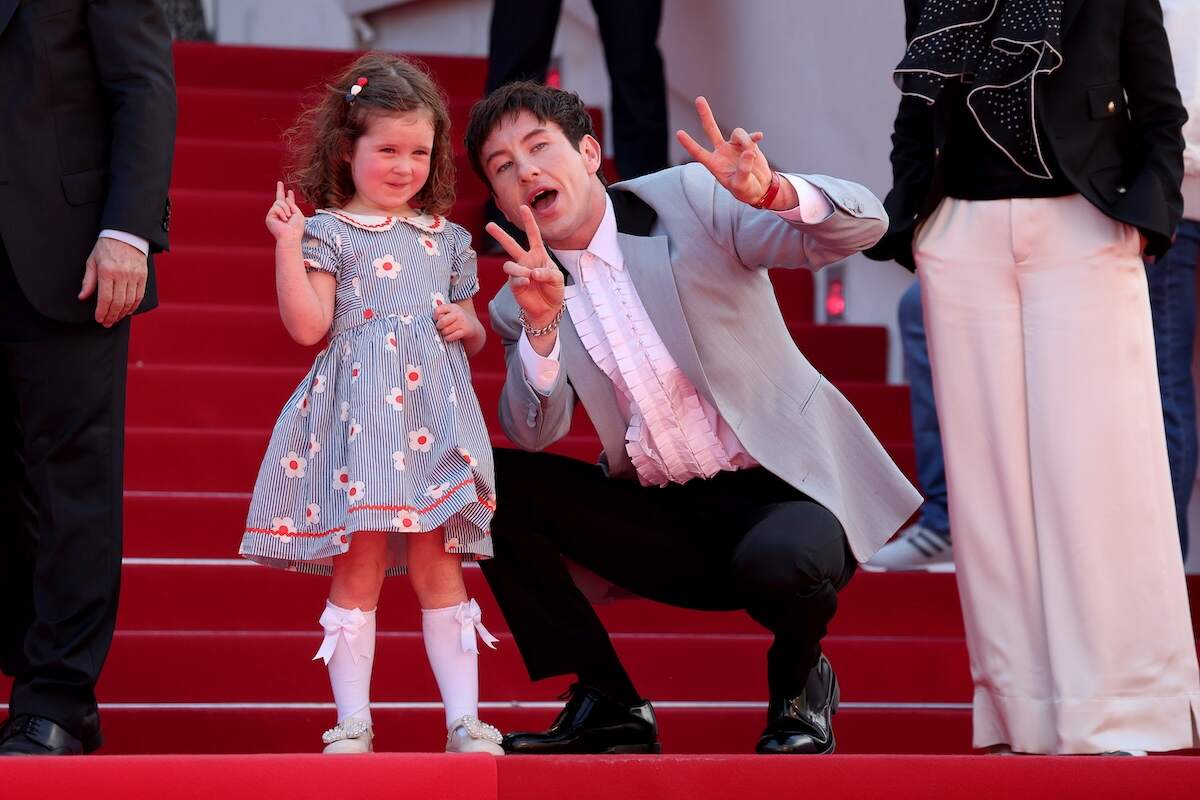 Actors Barry Keoghan and Jackie Mellor hold up peace signs for the cameras at the 77th edition of the Cannes Film Festival