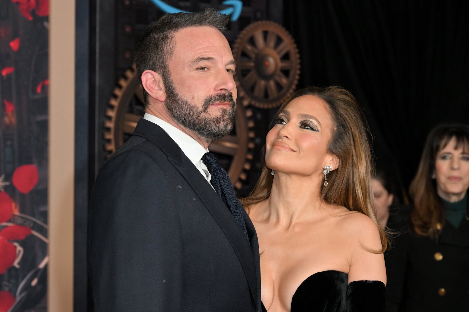 Jennifer Lopez looking up at Ben Affleck and smiling at a movie premiere in February 2024