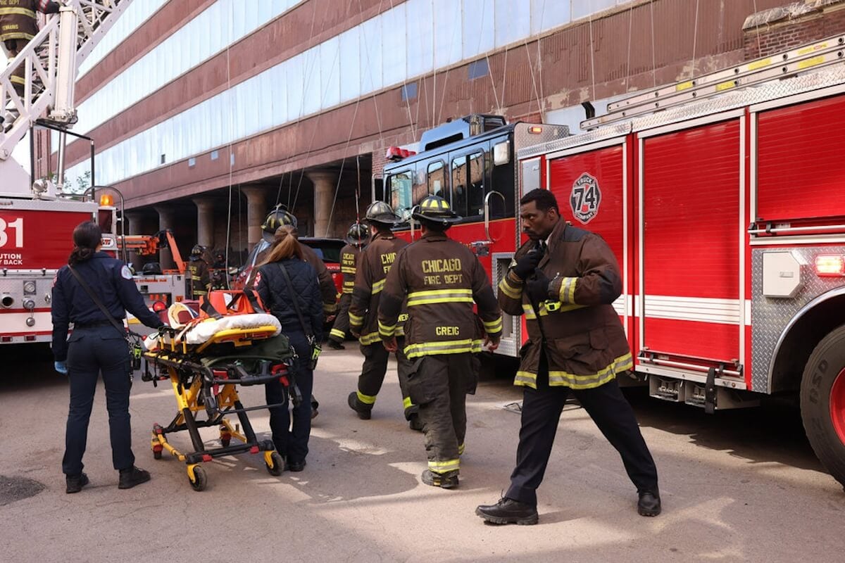 Firefighters and paramedics next to a truck in the 'Chicago Fire' Season 12 finale