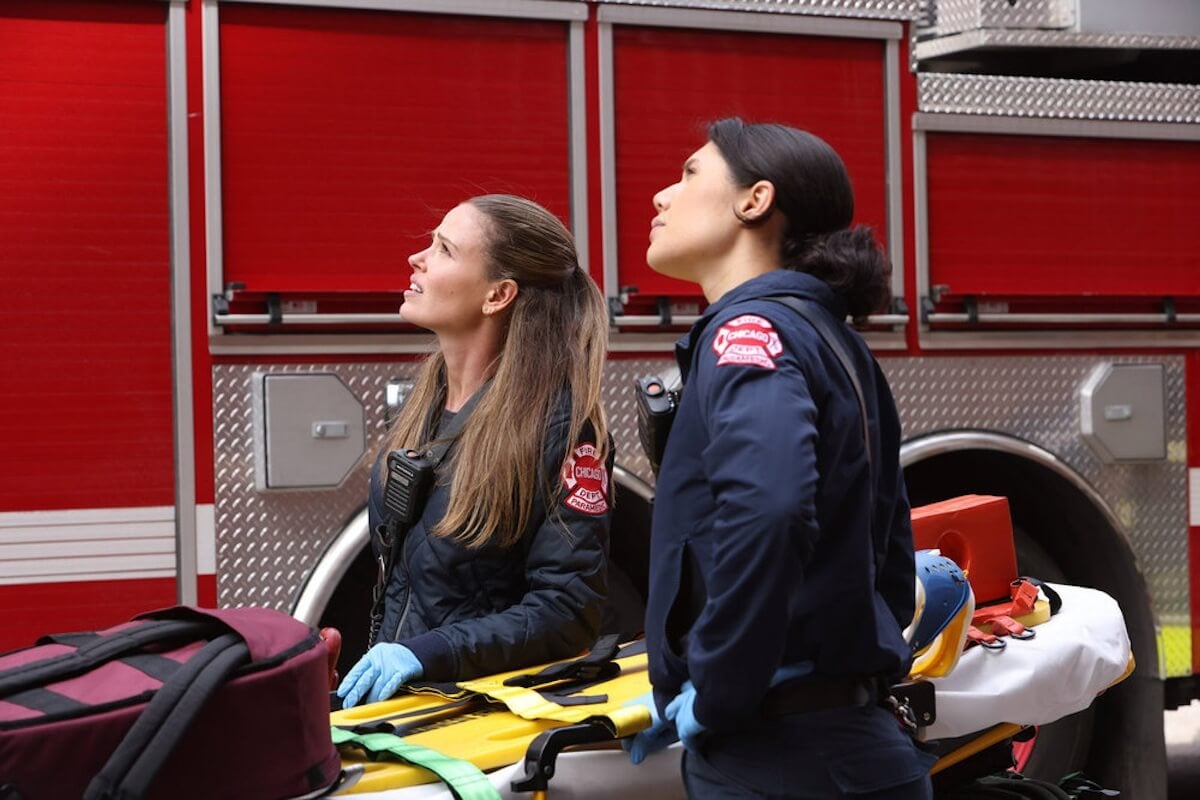 Two female paramedics looking up in the 'Chicago Fire' Season 12 finale