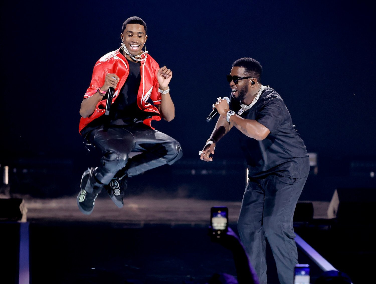 Christian 'King' Combs mid-jump on stage with Sean 'P. Diddy' Combs