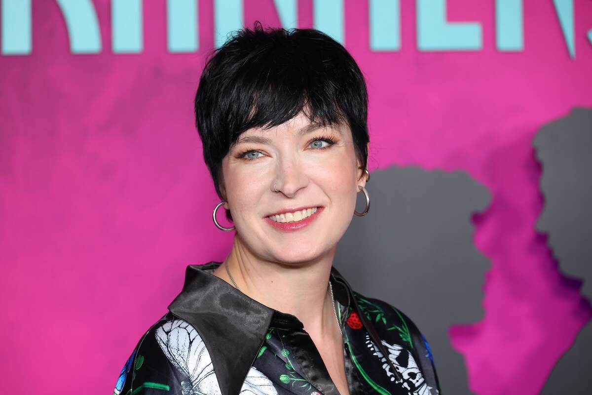 Diablo Cody wears a black top while she walks the red carpet at a screening of Lisa Frankenstein in 2024