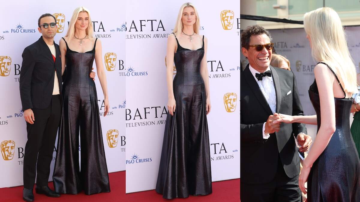 Actors Khalid Abdalla and Elizabeth Debicki stand together on the 2024 BAFTA red carpet while wearing black outfits