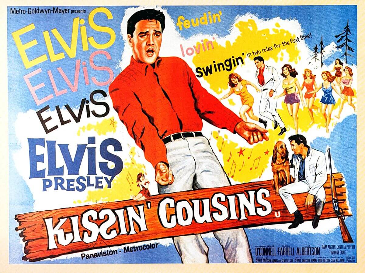 Elvis wears a red shirt on a poster for the film 'Kissin' Cousins.'