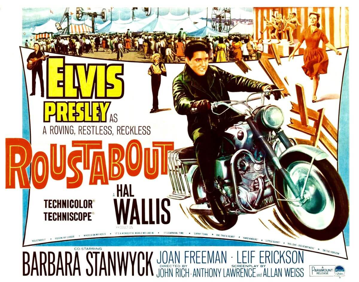 Elvis rides a motorcycle on a poster for the film 'Roustabout.'