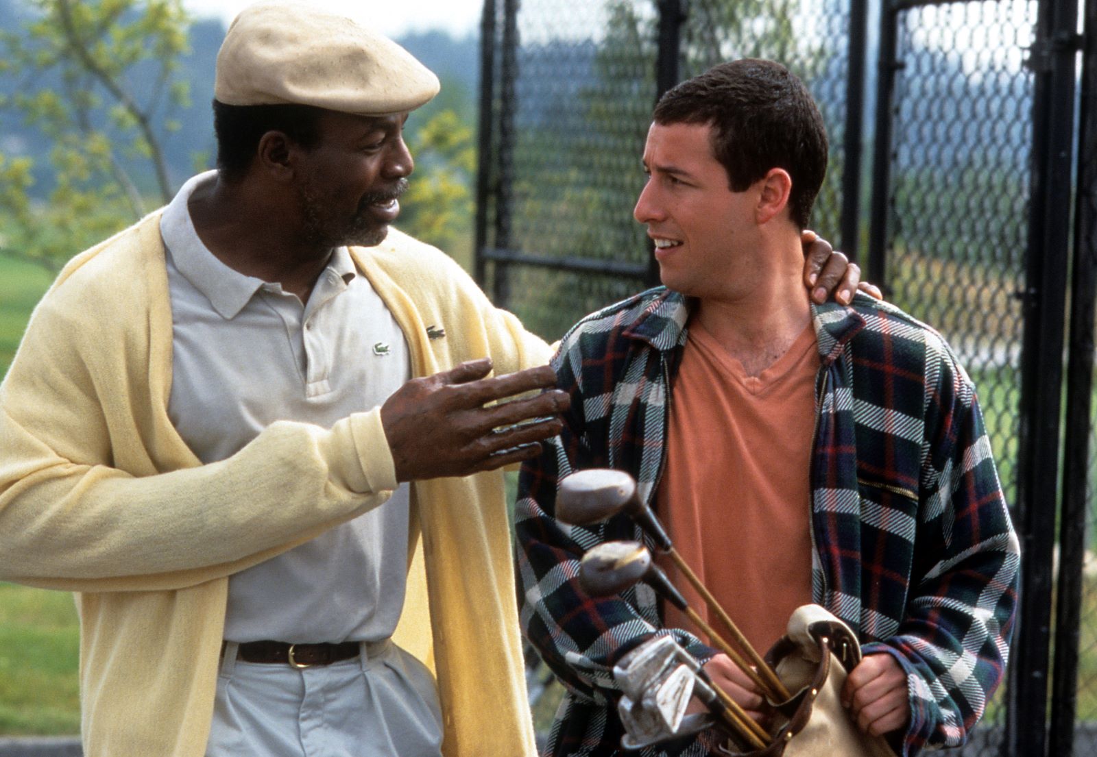 Carl Weathers and Adam Sandler in a scene from 'Happy Gilmore' available on Netflix.