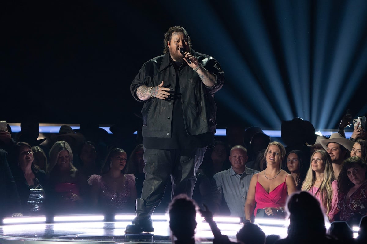 Jelly Roll, holding a microphone, performing at the 2023 Academy of Country Music Awards