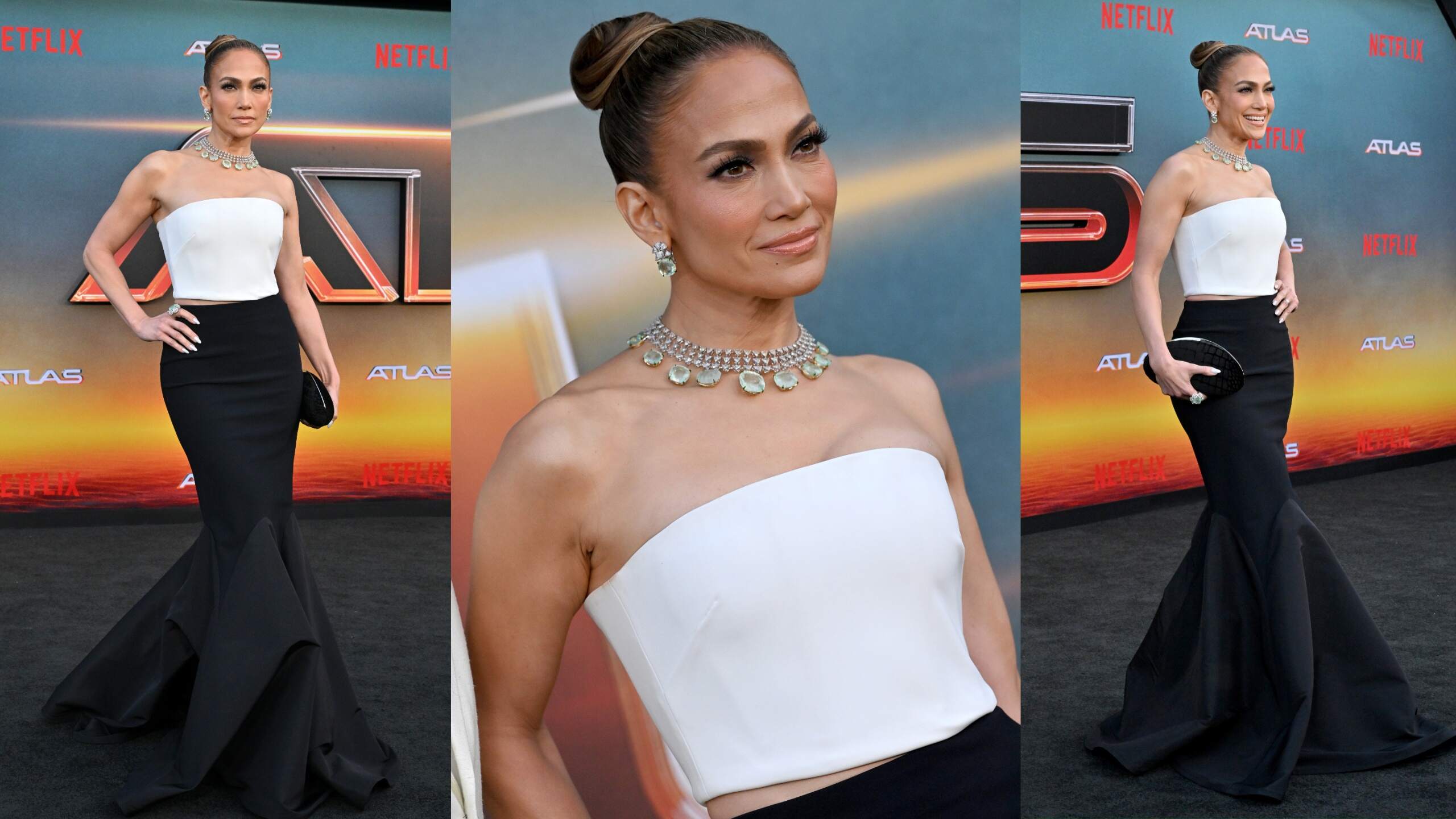 Wear a white bandeau top and black mermaid style skirt, Jennifer Lopez poses for photos on the Atlas red carpet
