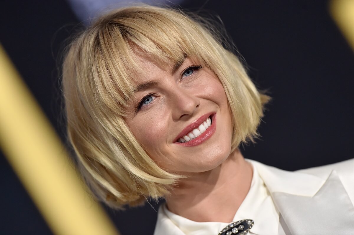 Julianne Hough smiling while at the premiere of 'A Star Is Born'.