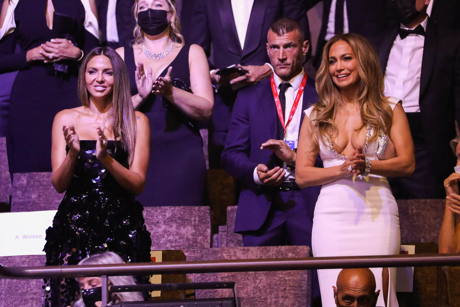 Luciana Barroso and Jennifer Lopez standing next to each other and clapping while at the Cartier Glory To The Filmmaker Award Ceremony during the 78th Venice International Film Festival on Sept. 10, 2021 in Venice, Italy