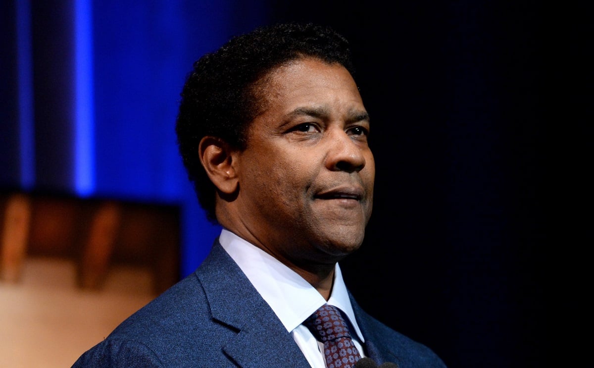 Denzel Washington posing on stage at the Santa Barbara International Film Festival.