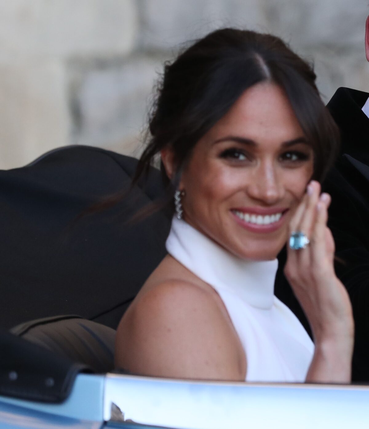 Meghan Markle wearing an aquamarine ring that once belonged to Princess Diana as she heads to her and Prince Harry's wedding reception