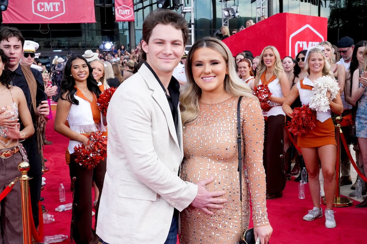 Montana Jordan with his hand on Jenna Weeks' pregnant belly