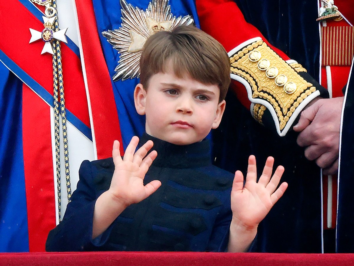 Prince Louis watches a flypast from the balcony of Buckingham Palace following the coronation