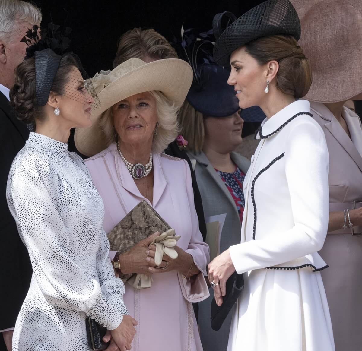 Queen Letizia of Spain chats with Queen Camilla and Kate Middleton during the Order of the Garter Service at St. George's Chapel 