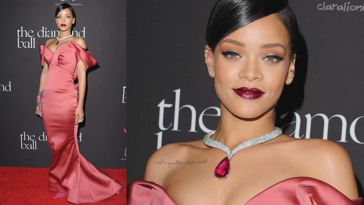 Singer Rihanna wears a rose satin dress and large pink necklace to a gala in 2014