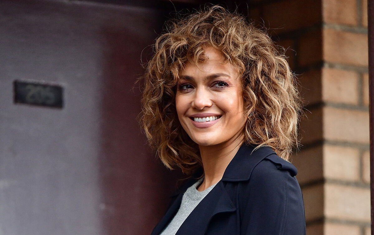 Jennifer Lopez smiling on the set of 'Shades of Blue'.