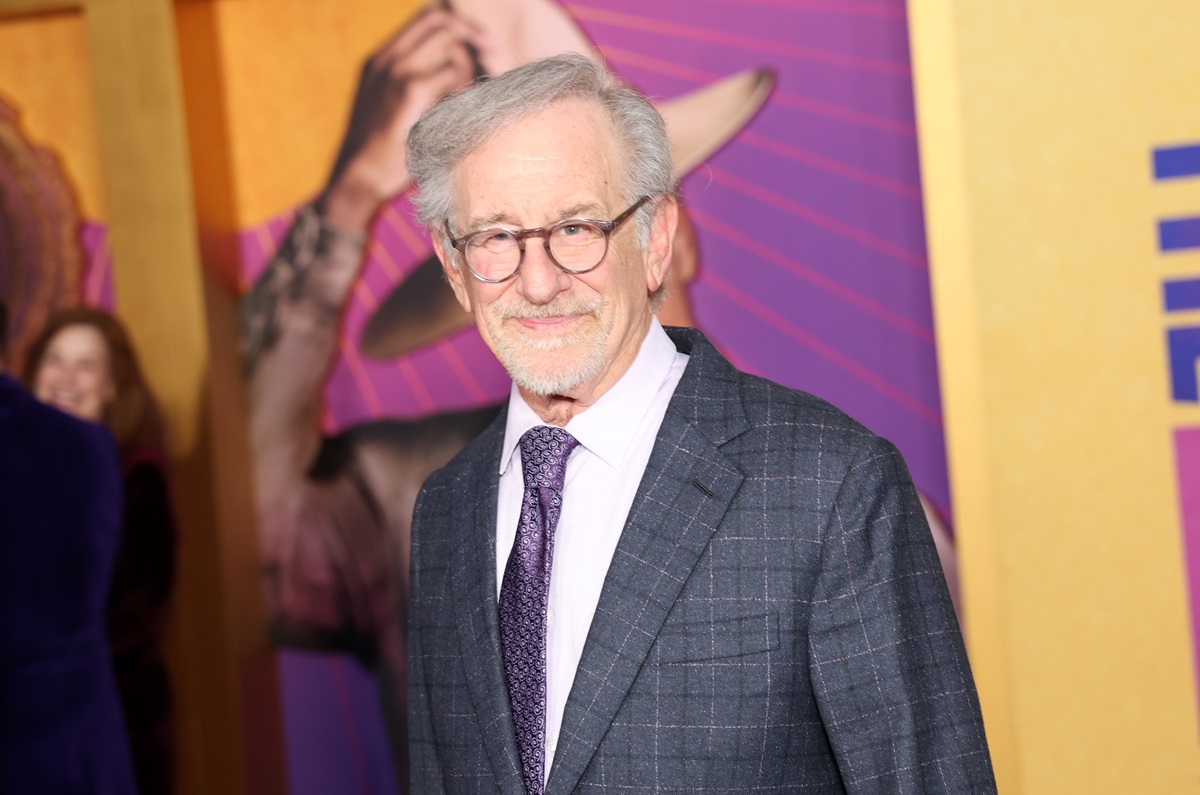 Steven Spielberg posing at 'The Color Purple' premiere.