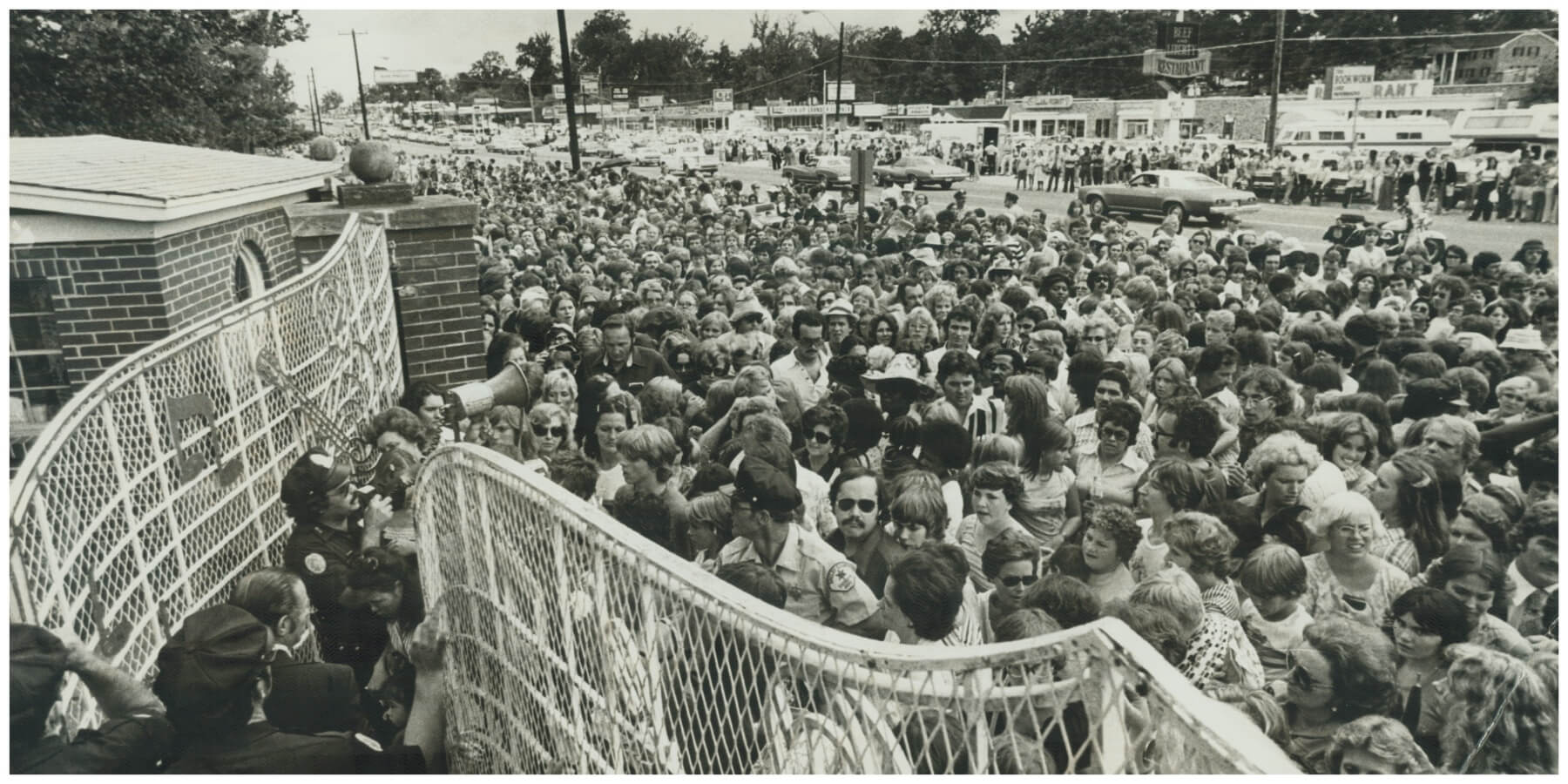 Elvis Presley fans gathered outside of Graceland in August 1977 after his death.