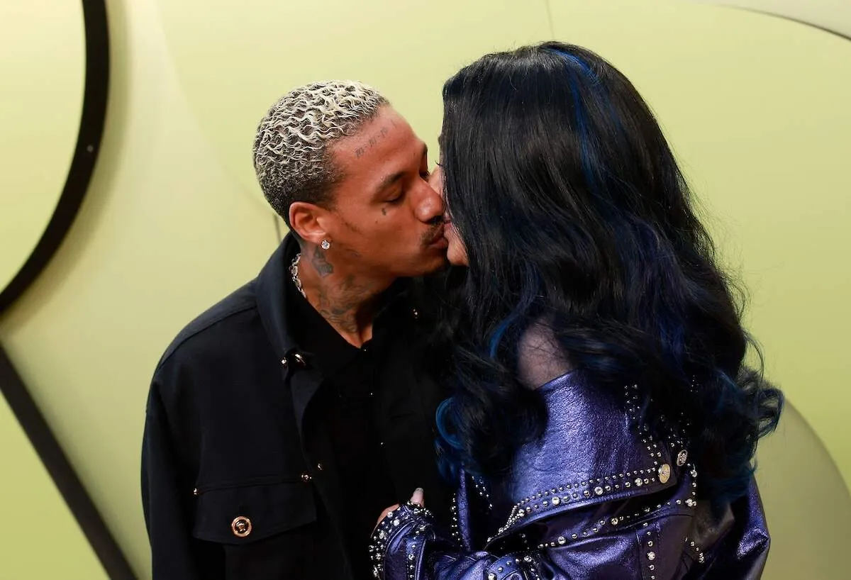 Couple Alexander Edwards and Cher, kissing, make one of the first public appearances together