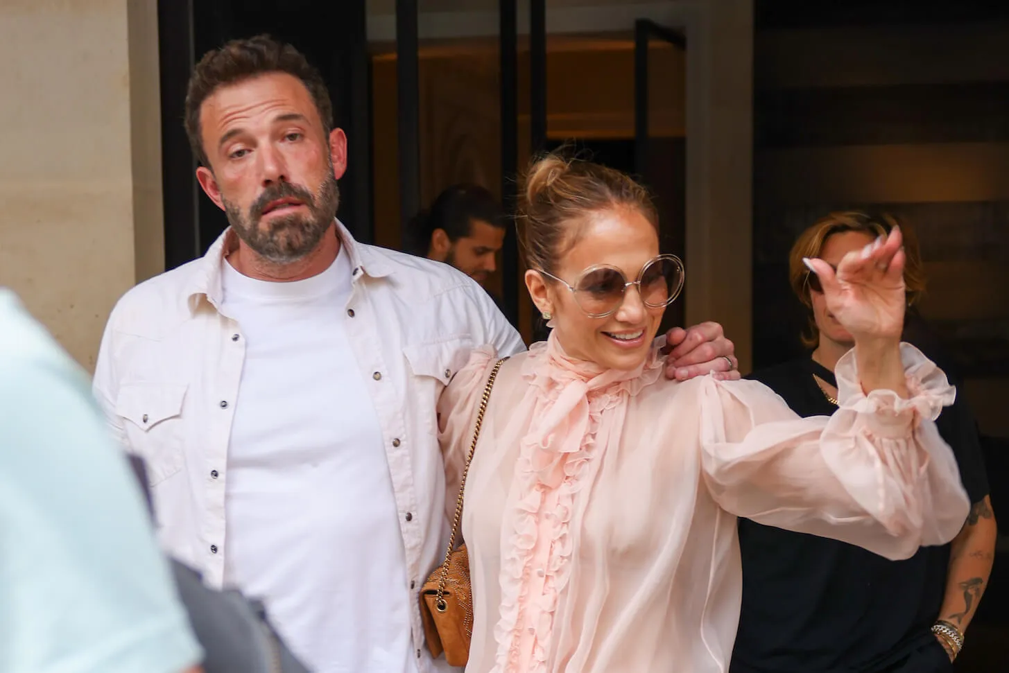 Ben Affleck looking bored as Jennifer Lopez waves and smiles in public in 2022