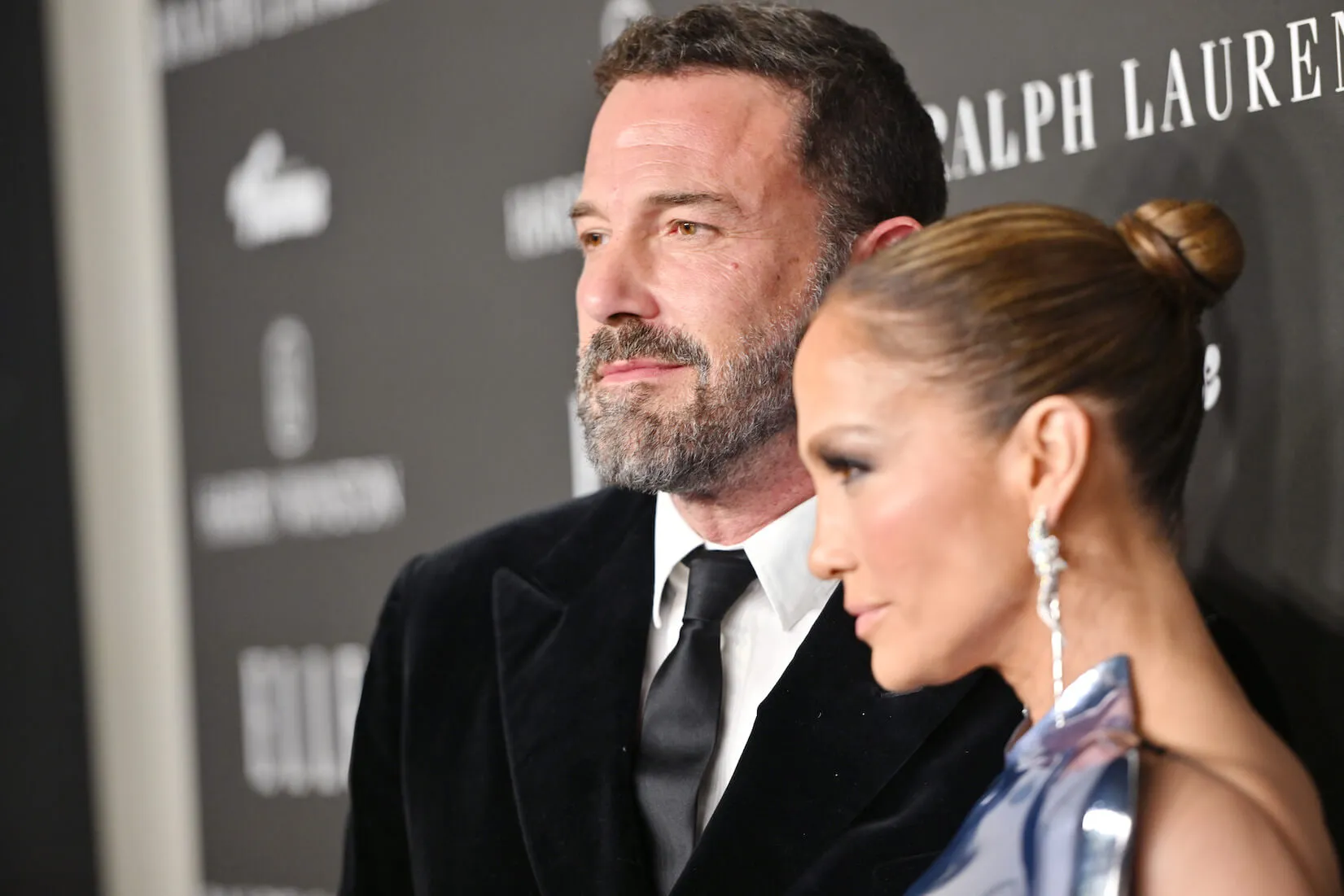 Ben Affleck in focus and Jennifer Lopez in the foreground out of focus at a movie premiere in 2023