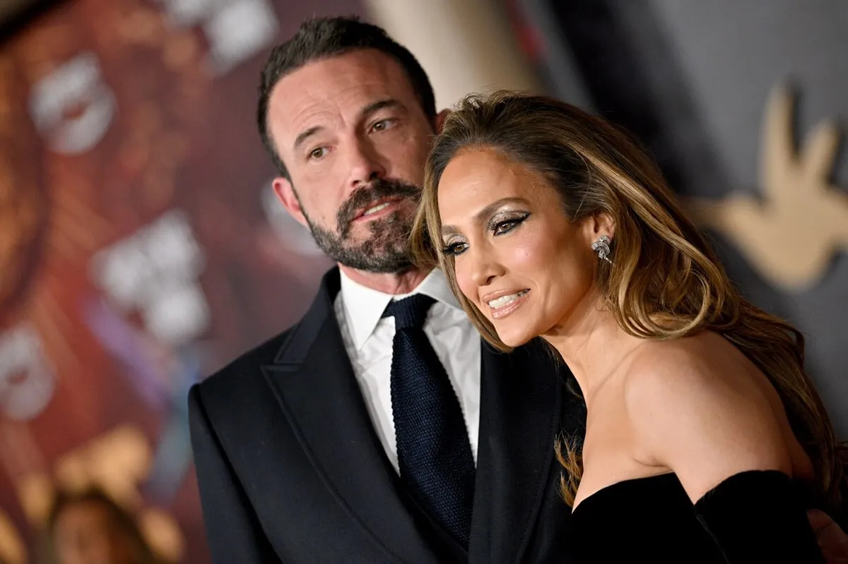 Ben Affleck and Jennifer Lopez attend the Los Angeles Premiere Of Amazon MGM Studios "This Is Me...Now: A Love Story" wearing a suit and dress respectively.