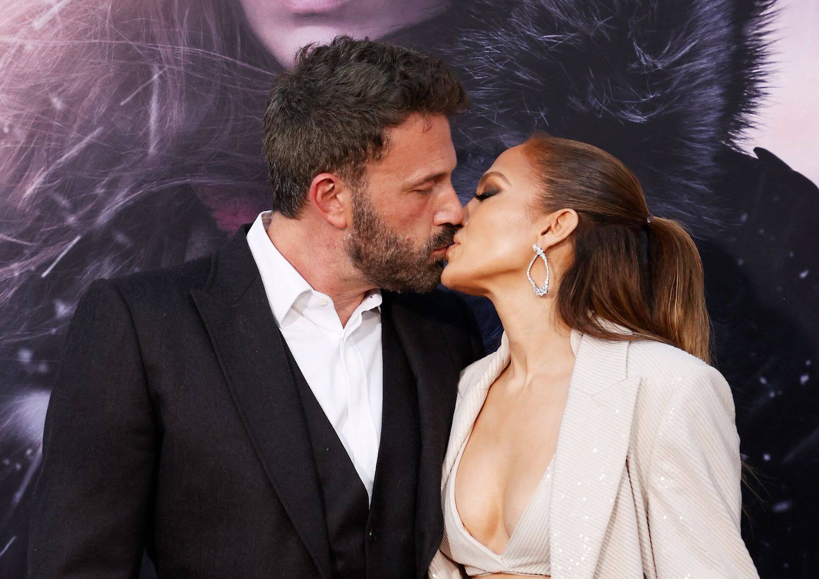 Ben Affleck and Jennifer Lopez kissing at a film premiere in May 2023