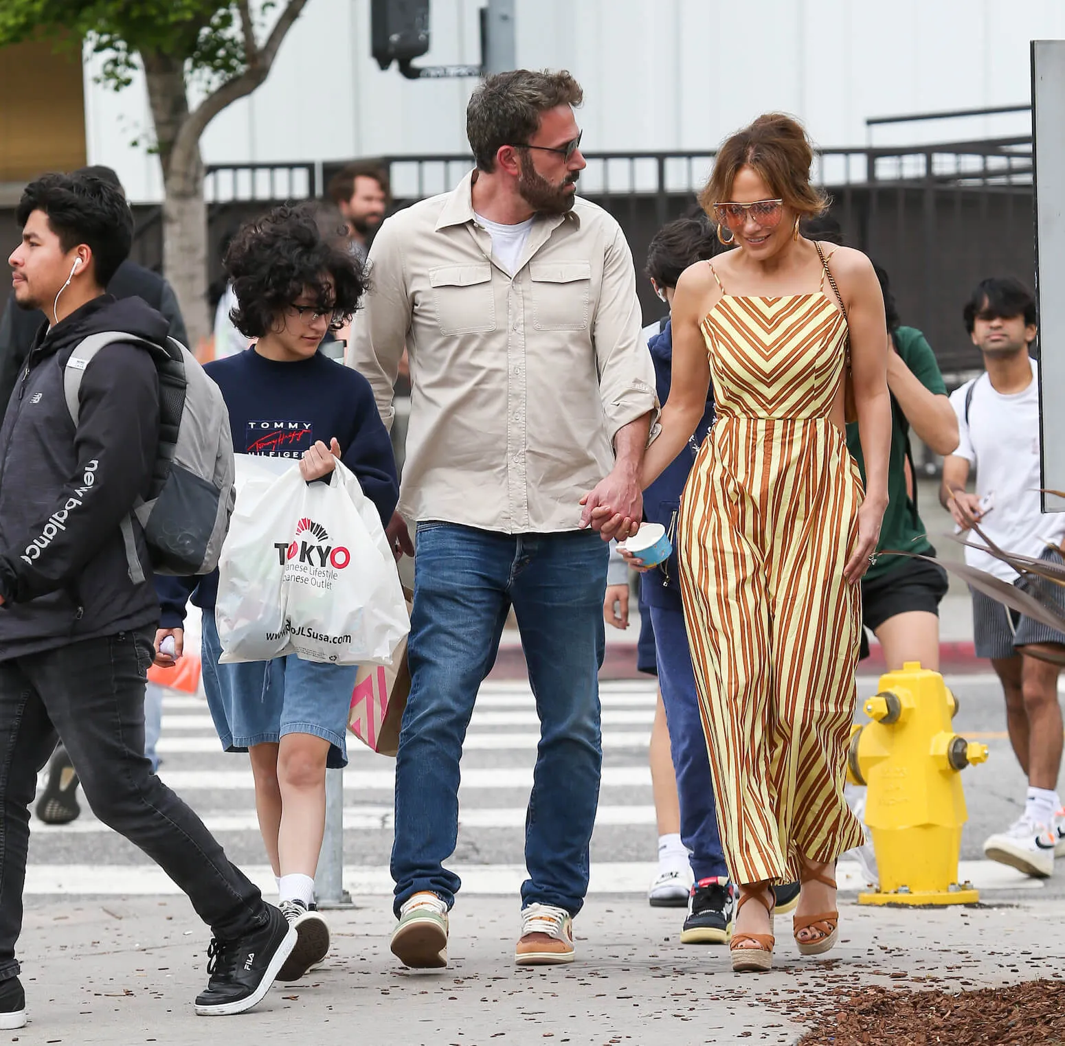 Emme Maribel Muniz, Ben Affleck, and Jennifer Lopez walking together in Los Angeles 