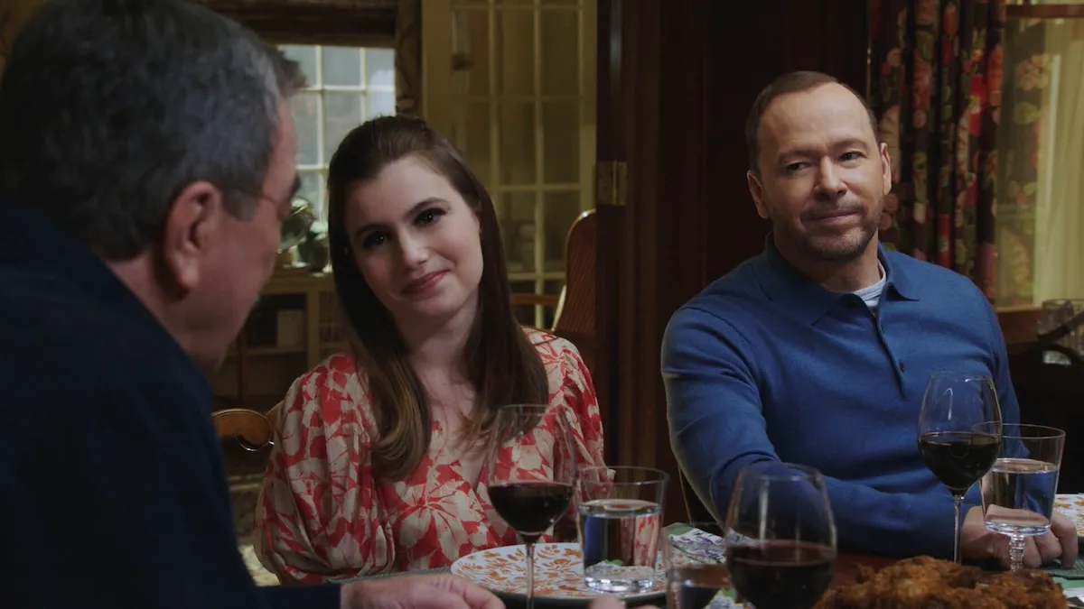 Nicky and Danny sitting at the dinner table and looking at Frank in 'Blue Bloods'