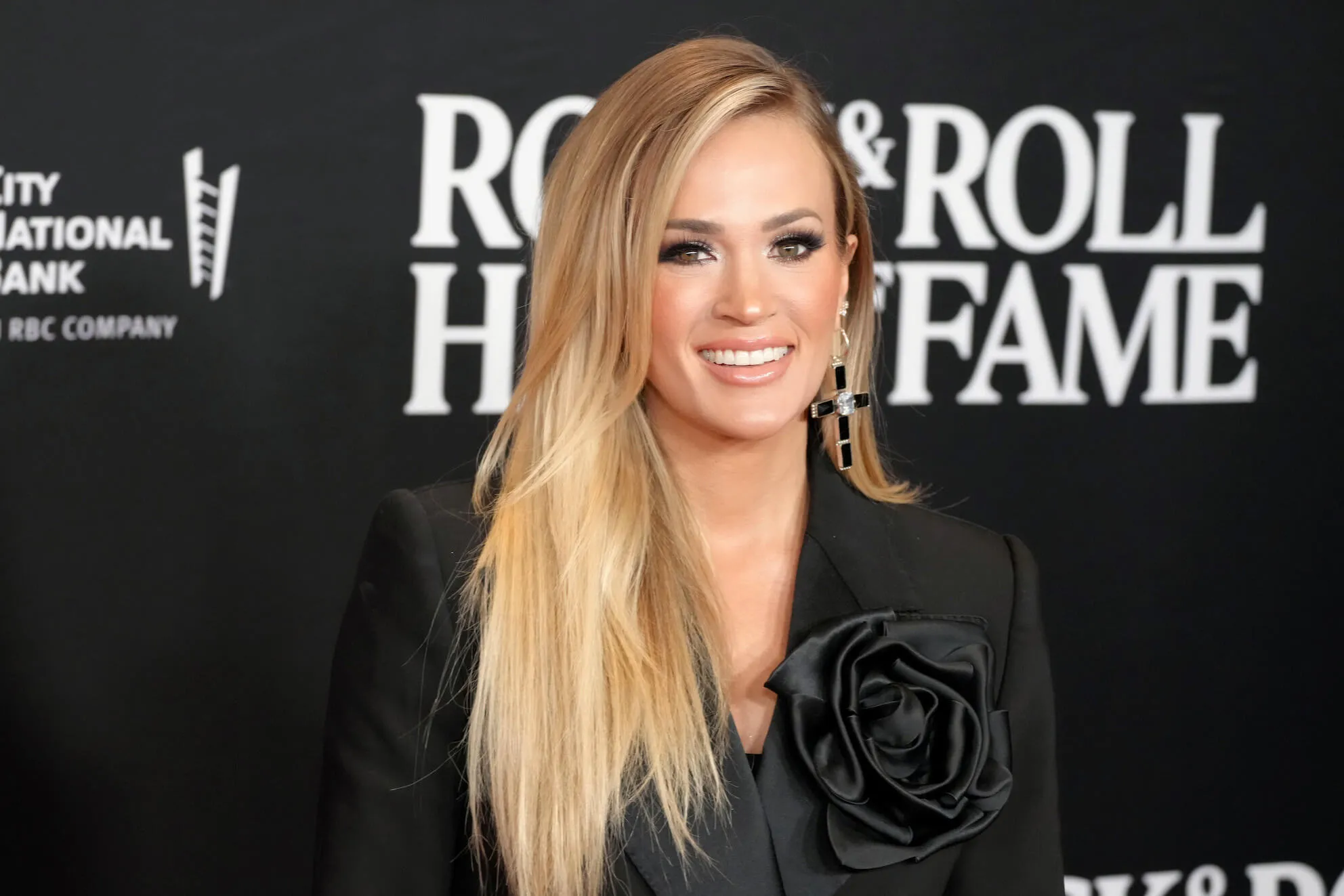 Carrie Underwood smiling at the Rock & Roll Hall of Fame in 2023