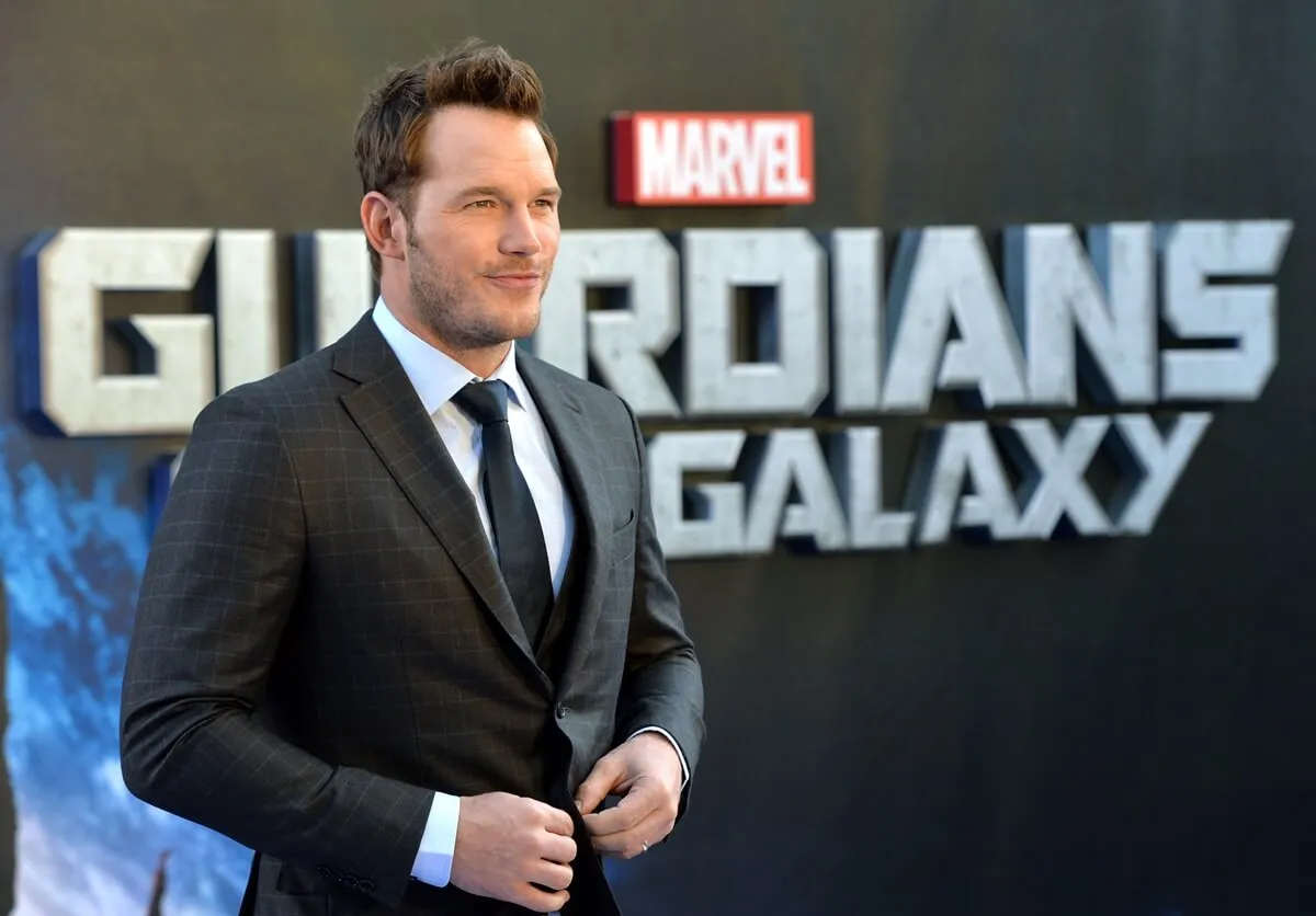 Chris Pratt posing in a suit at the premiere of 'Guardians of the Galaxy'.