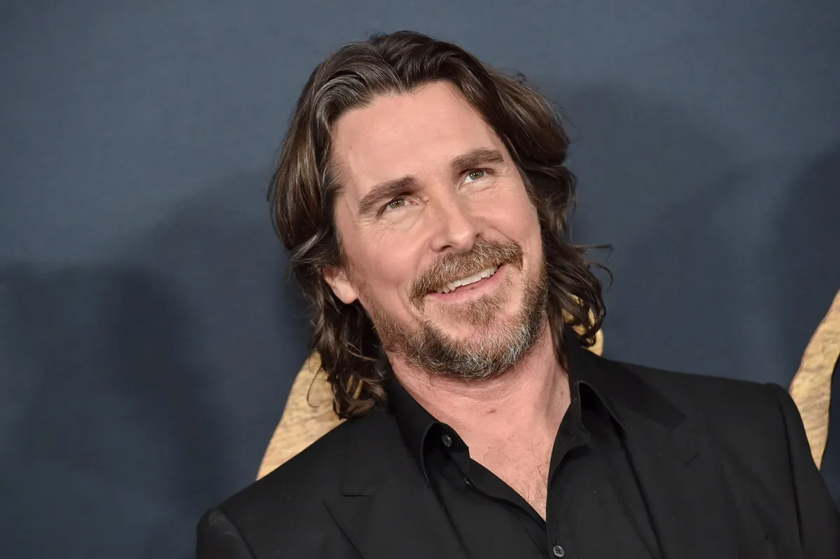 Christian Bale posing at the premiere of 'Pale Blue Eye'.