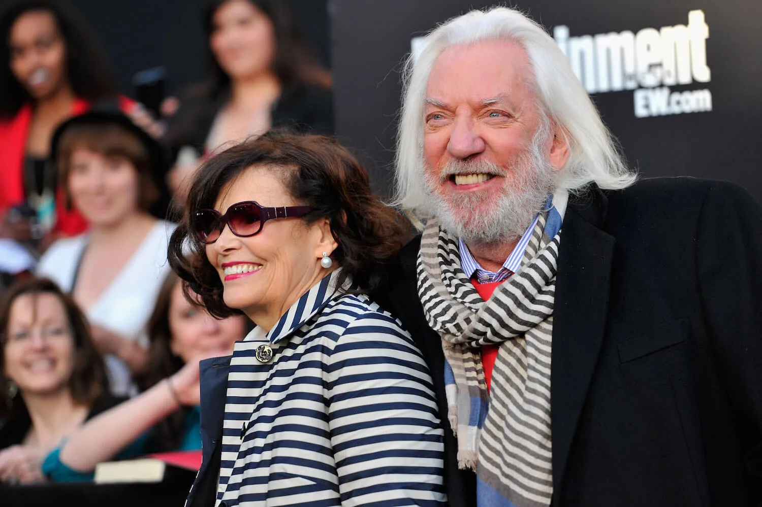 Francine Racette and actor Donald Sutherland arrive to the premiere of 'The Hunger Games' in 2012