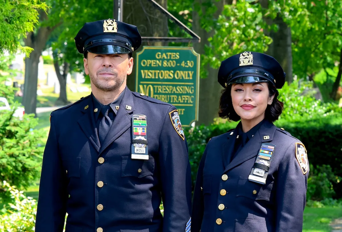 Donnie Wahlberg and Marisa Ramirez dressed in police uniforms on the set of 'Blue Bloods'