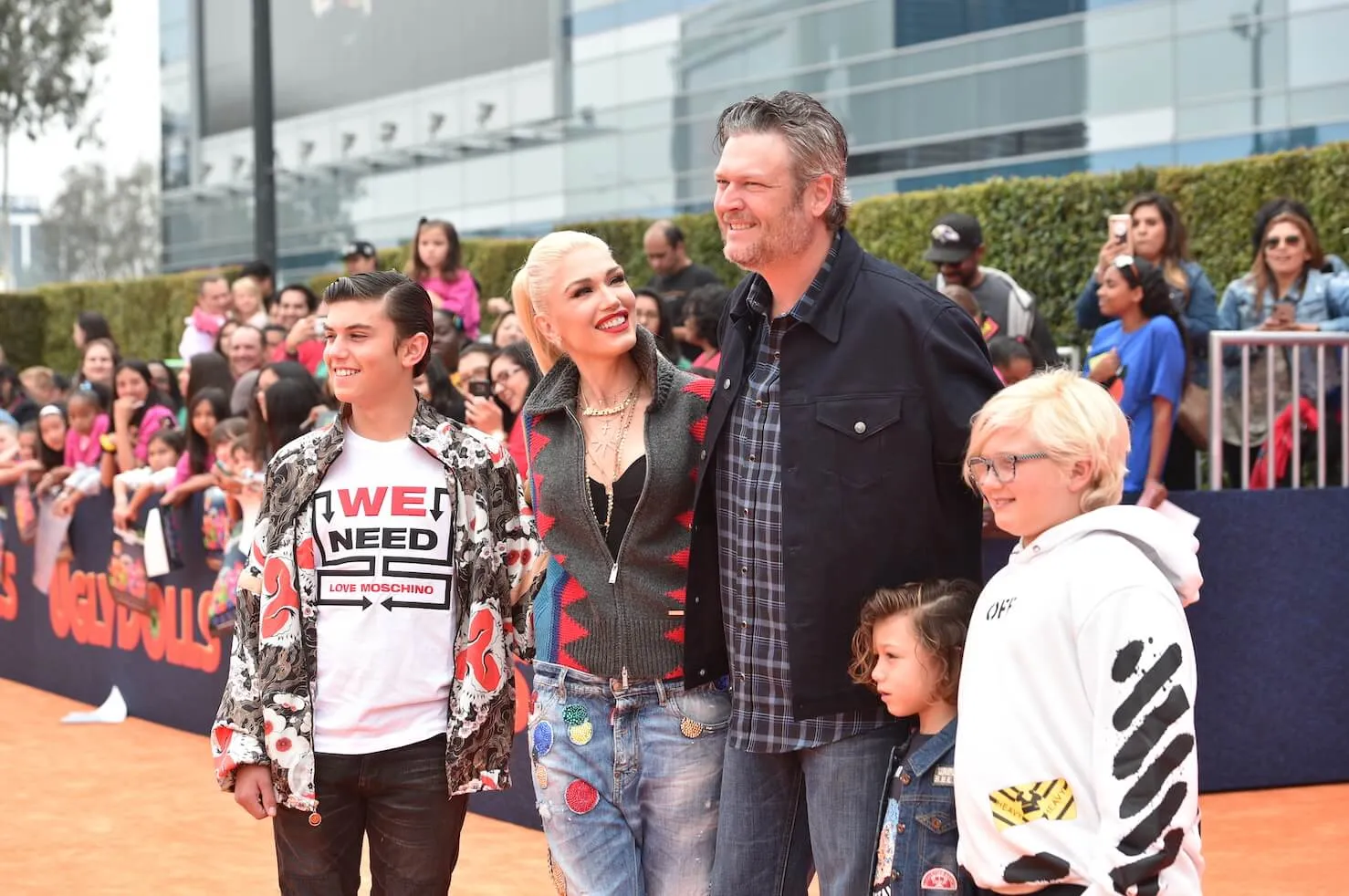 Gwen Stefani, Blake Shelton, Apollo Rossdale, and Zuma Rossdale posing together at a movie premiere in 2019