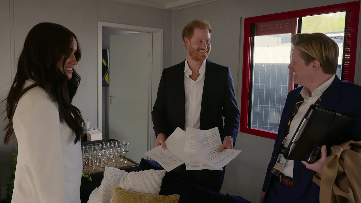 Prince Harry holding papers in an episode of 'Heart of Invictus'
