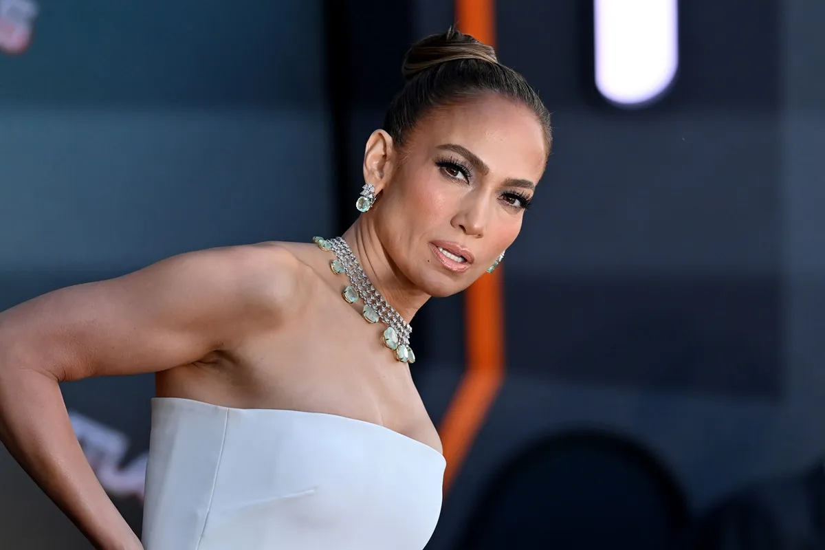 Jennifer Lopez posing in a white dress at the premiere of 'Atlas'.