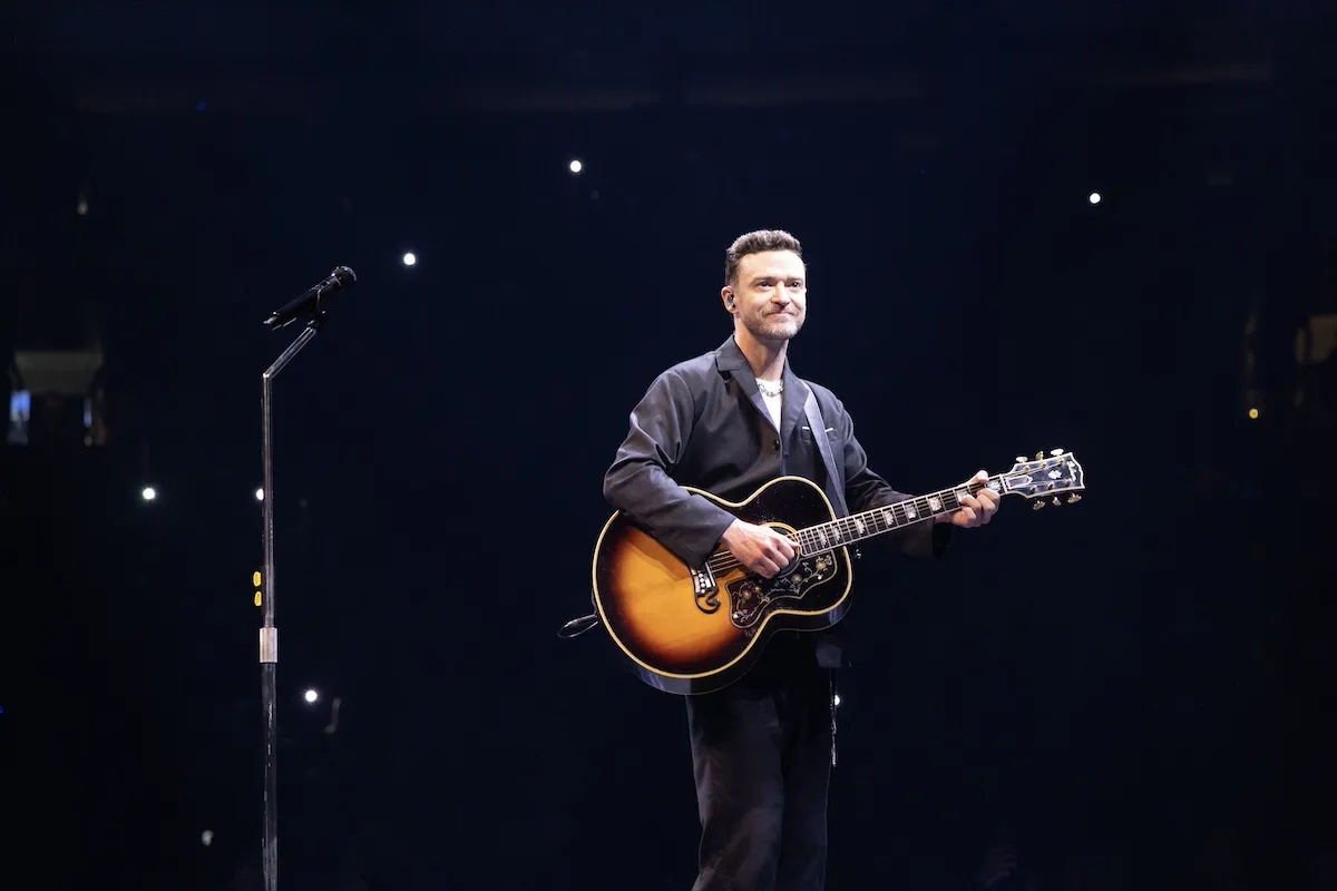 Justin Timberlake on stage with a guitar