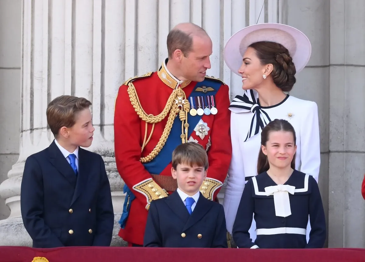 Prince William and Kate Middleton stand with their children at Trooping the Colour