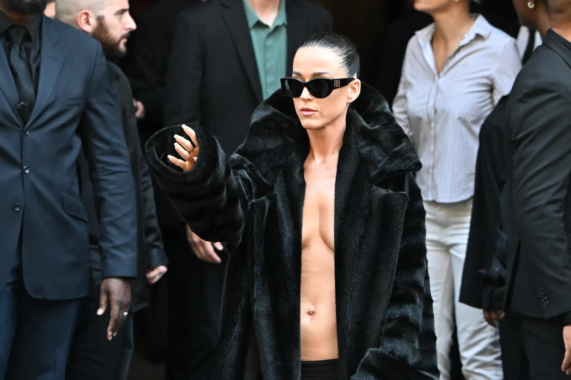 Katy Perry in a black coat with no shirt at the Balenciaga Haute Couture Fall/Winter 2024-2025 show