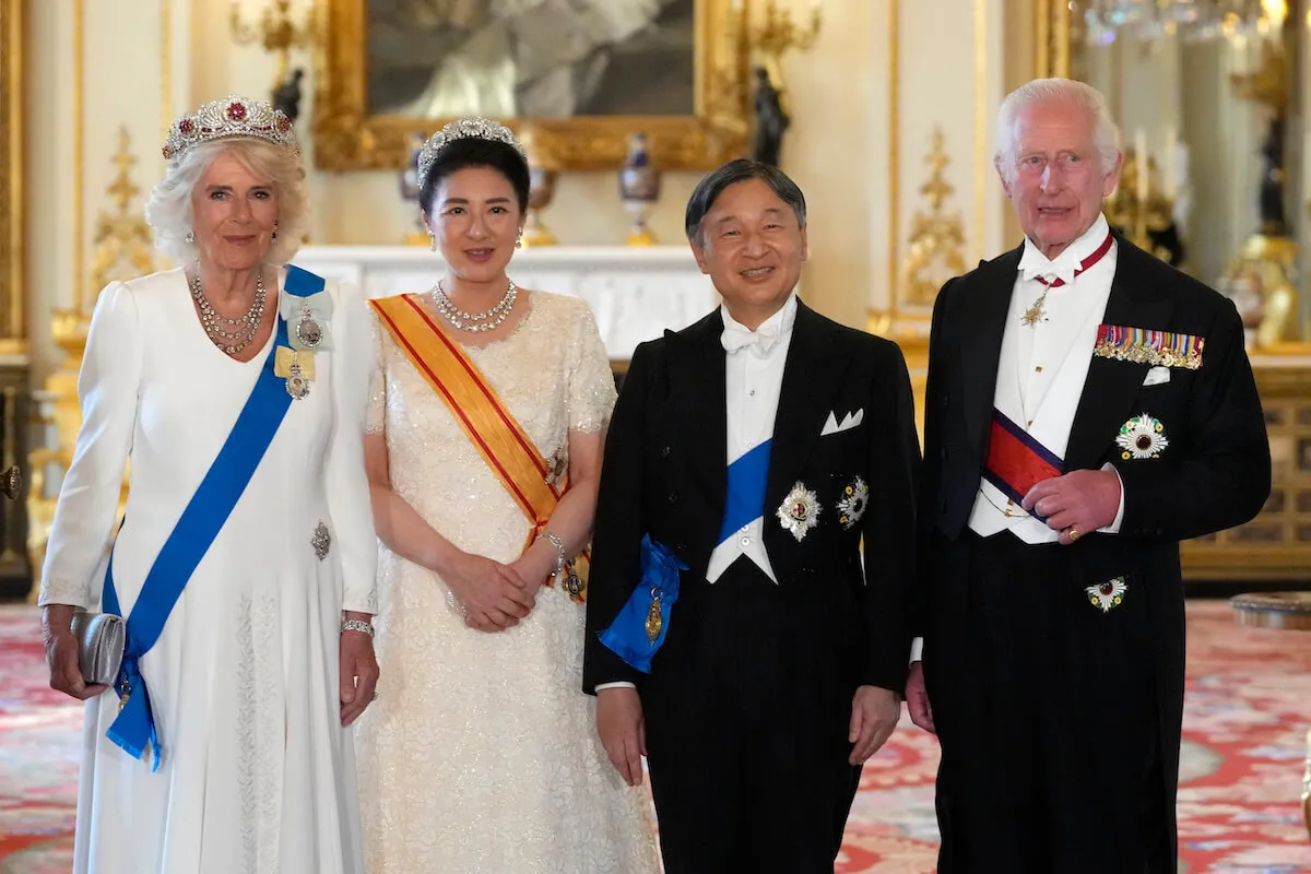 Queen Camilla, the Emperor and Empress of Japan, and King Charles stand next to each other.