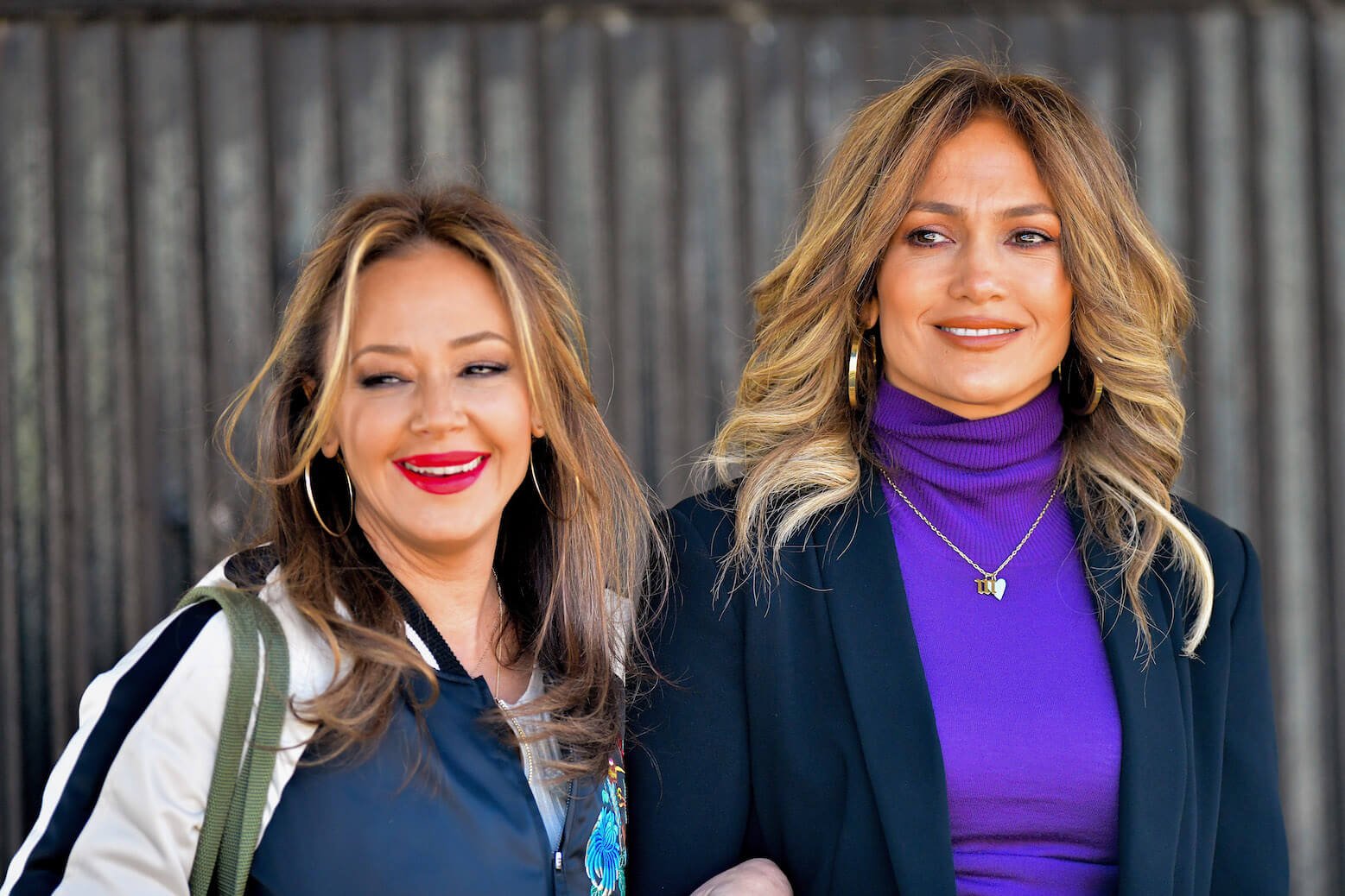 Leah Remini and Jennifer Lopez arm in arm in 2017