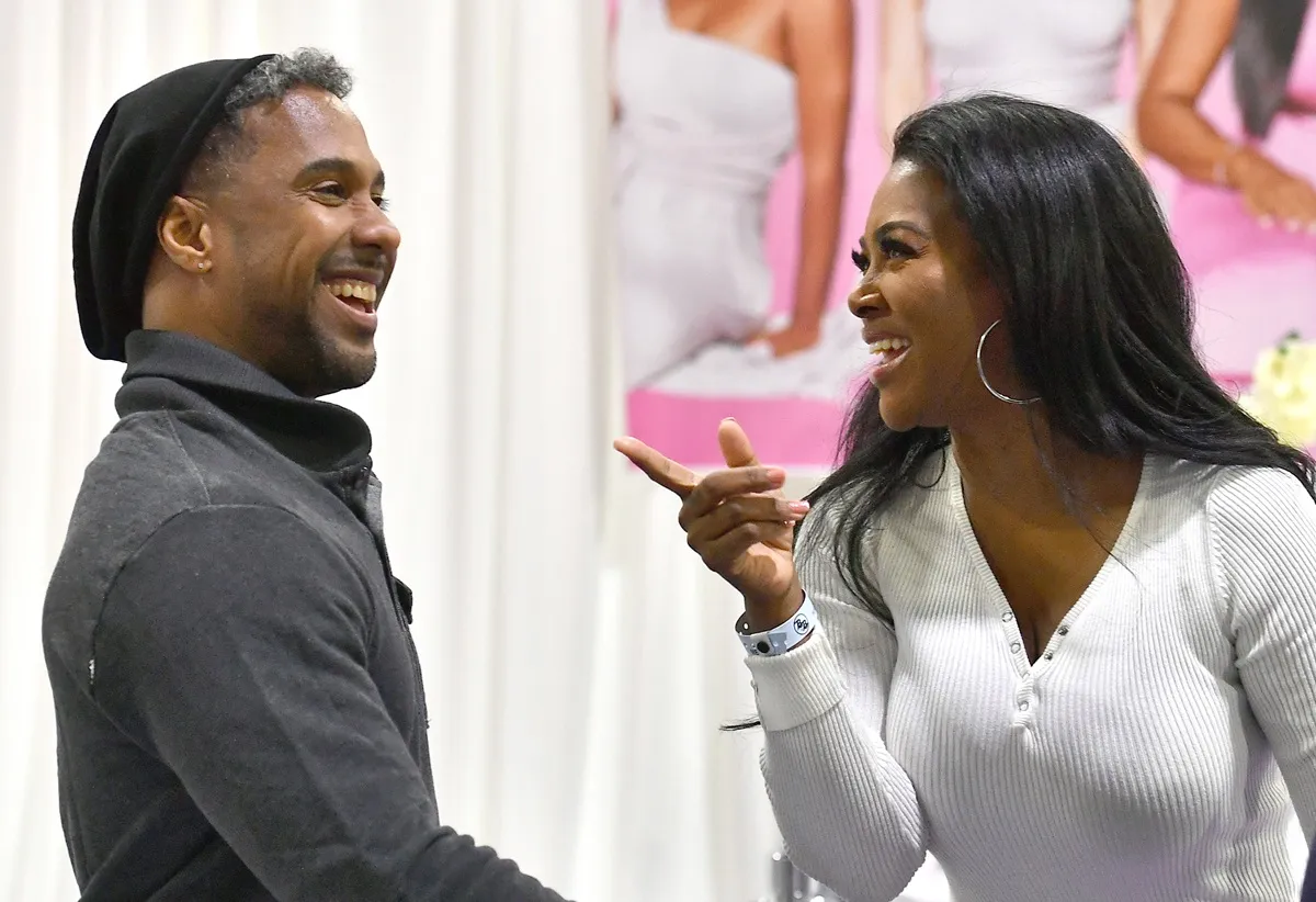 Marc Daly and Kenya Moore attend 2020 Bronner Brothers International Beauty Show at Georgia World Congress Center on February 08, 2020 in Atlanta, Georgia